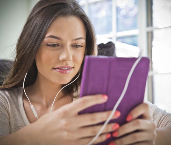 Student ear- reading on the tablet