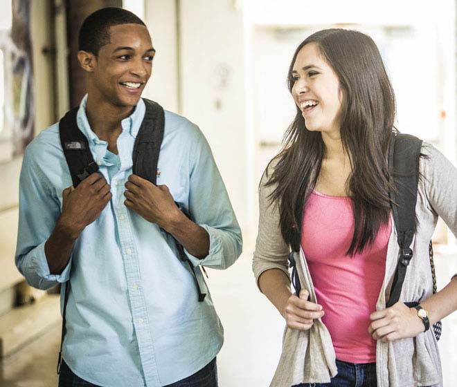 Middle school students walking down the hall