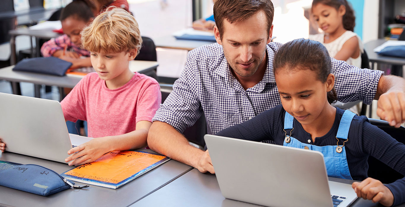 teacher helping student